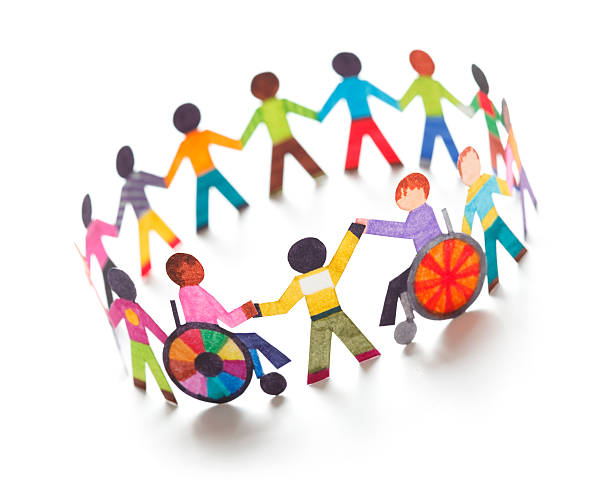Circle of paper figures holding hands that includes people in wheelchairs