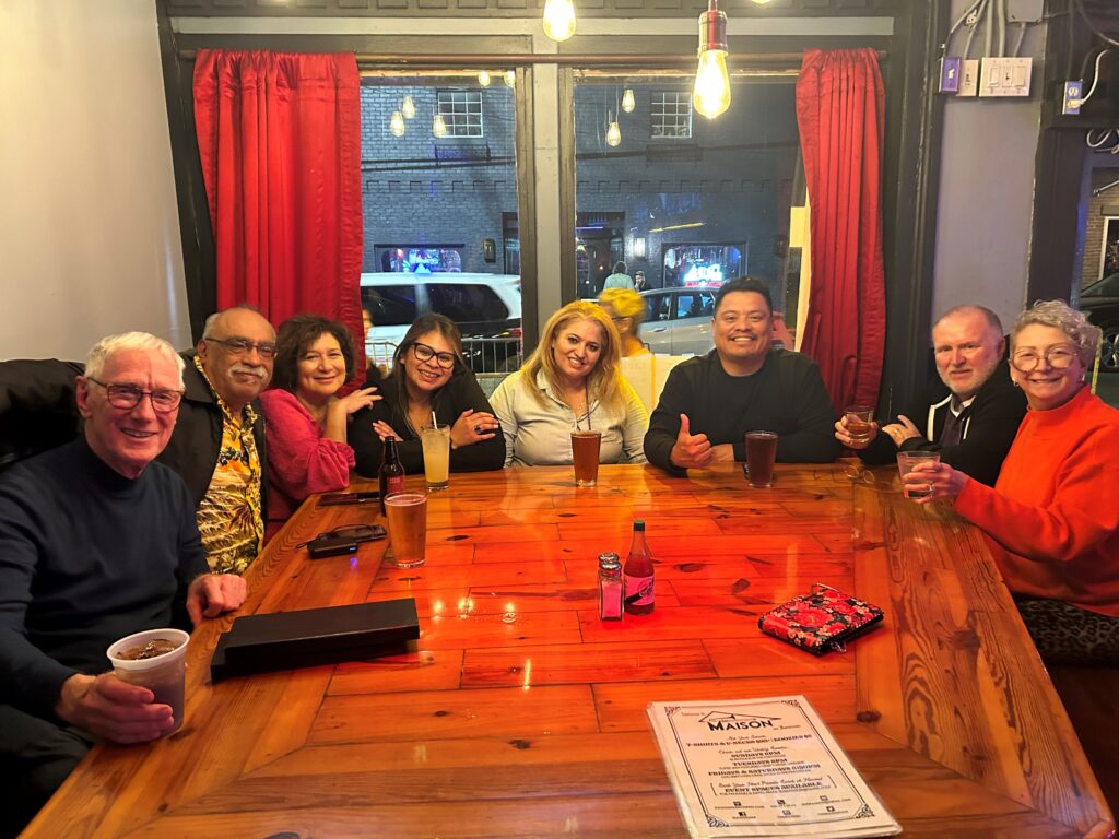 Staff and Board Members from The Arc of California sit around a dinner table